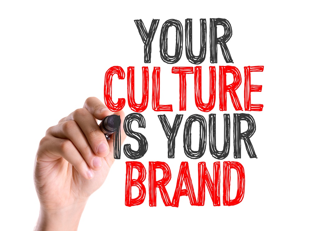 Hand with marker writing Your Culture Is Your Brand.jpeg